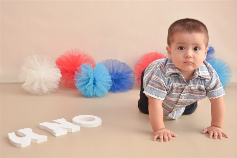Sweet baby during a portrait session before a cake smash birthday photoshoot in Surrey.